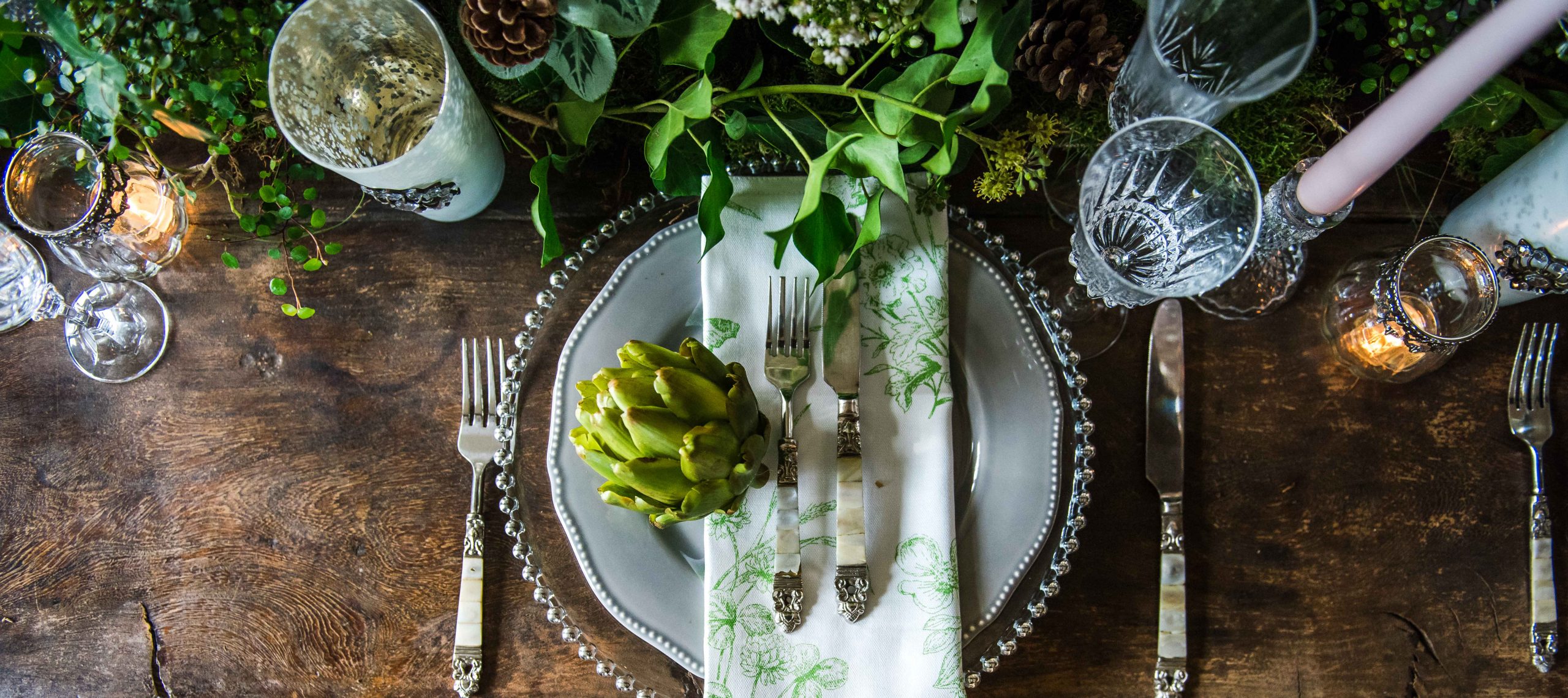 a table setting with artichoke