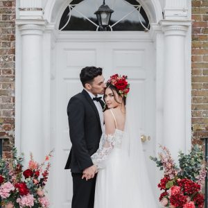 Bride and groom outside the front door of Swarling Manor Kent with Jeff Oliver Photographer